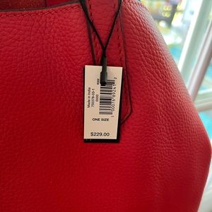 Red pebbled leather unlined handbag with inside pockets